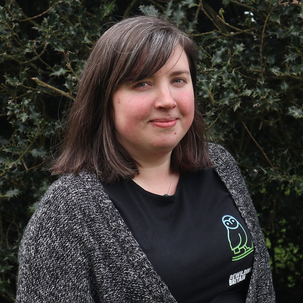 Charlotte Maddix, Scotland Advocacy Coordinator at Rewilding Britain, wearing a black Rewilding Britain t-shirt