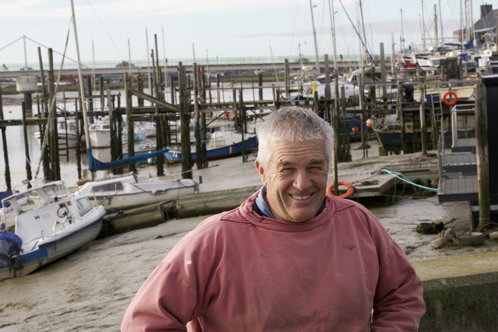 Fisherman Clive Mills standing by boats