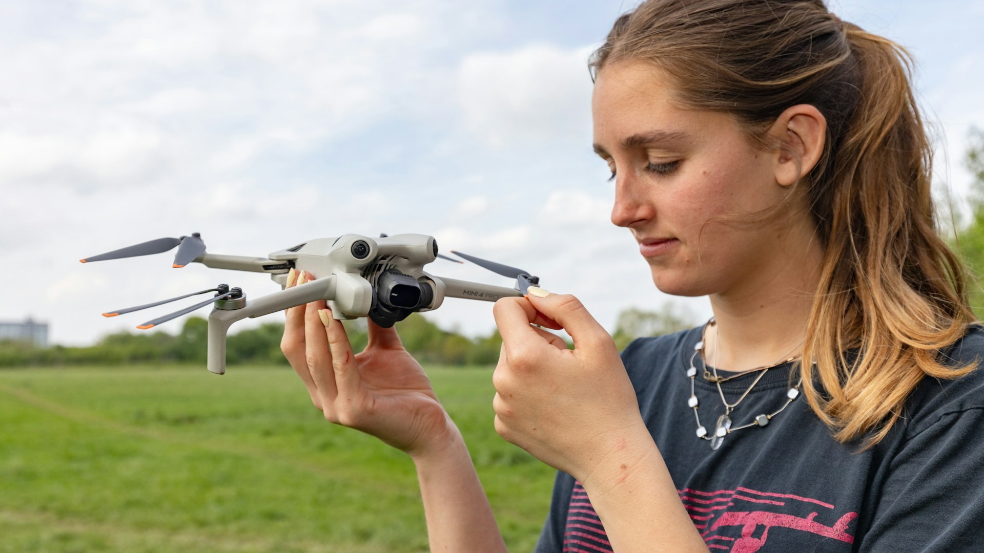 Woman holding a drone.