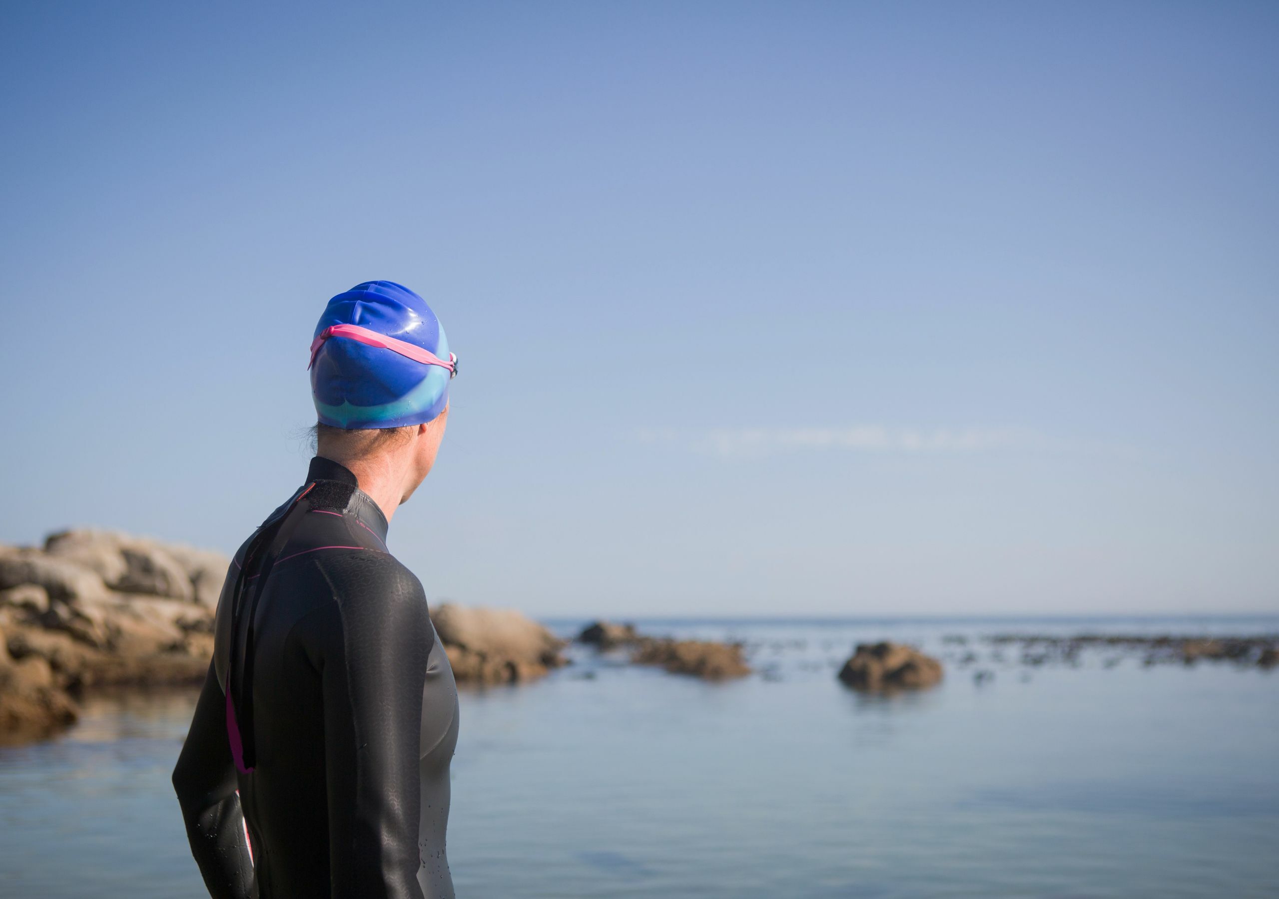 A woman looking out to see about to go for a cold swim