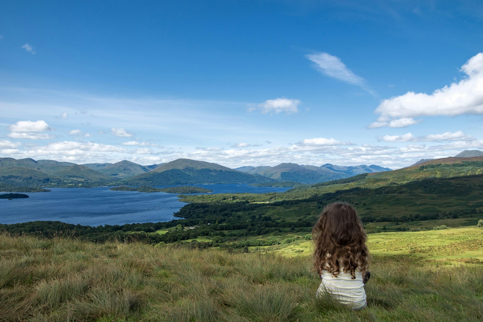 Girl sitting in National Park looking at views