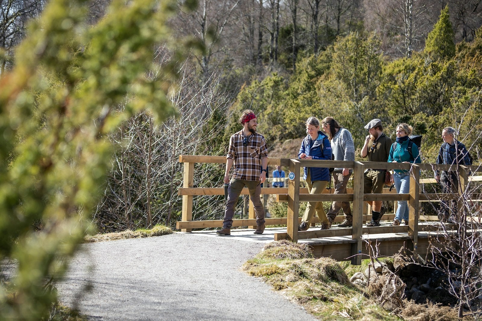 A tour guide gives a walking tour the Dundreggan Rewilding Centre