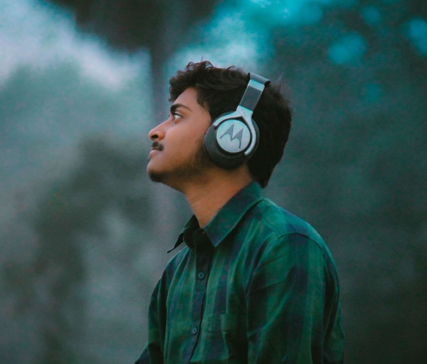 Man wearing headphones in nature