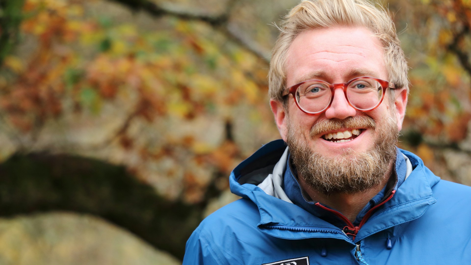 James Hitchcock, CEO of Radnorshire Wildlife Trust, standing in woodland