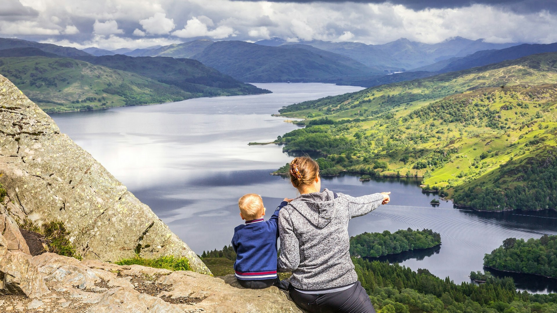 Mam and boy overlook views in Scotland