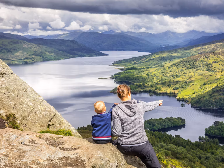 Mam and boy overlook views in Scotland