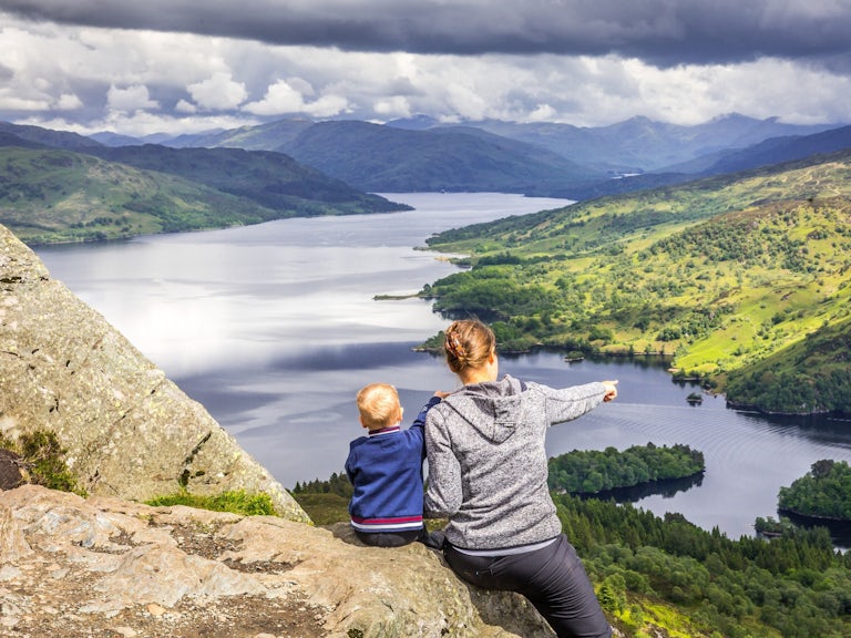 Mam and boy overlook views in Scotland