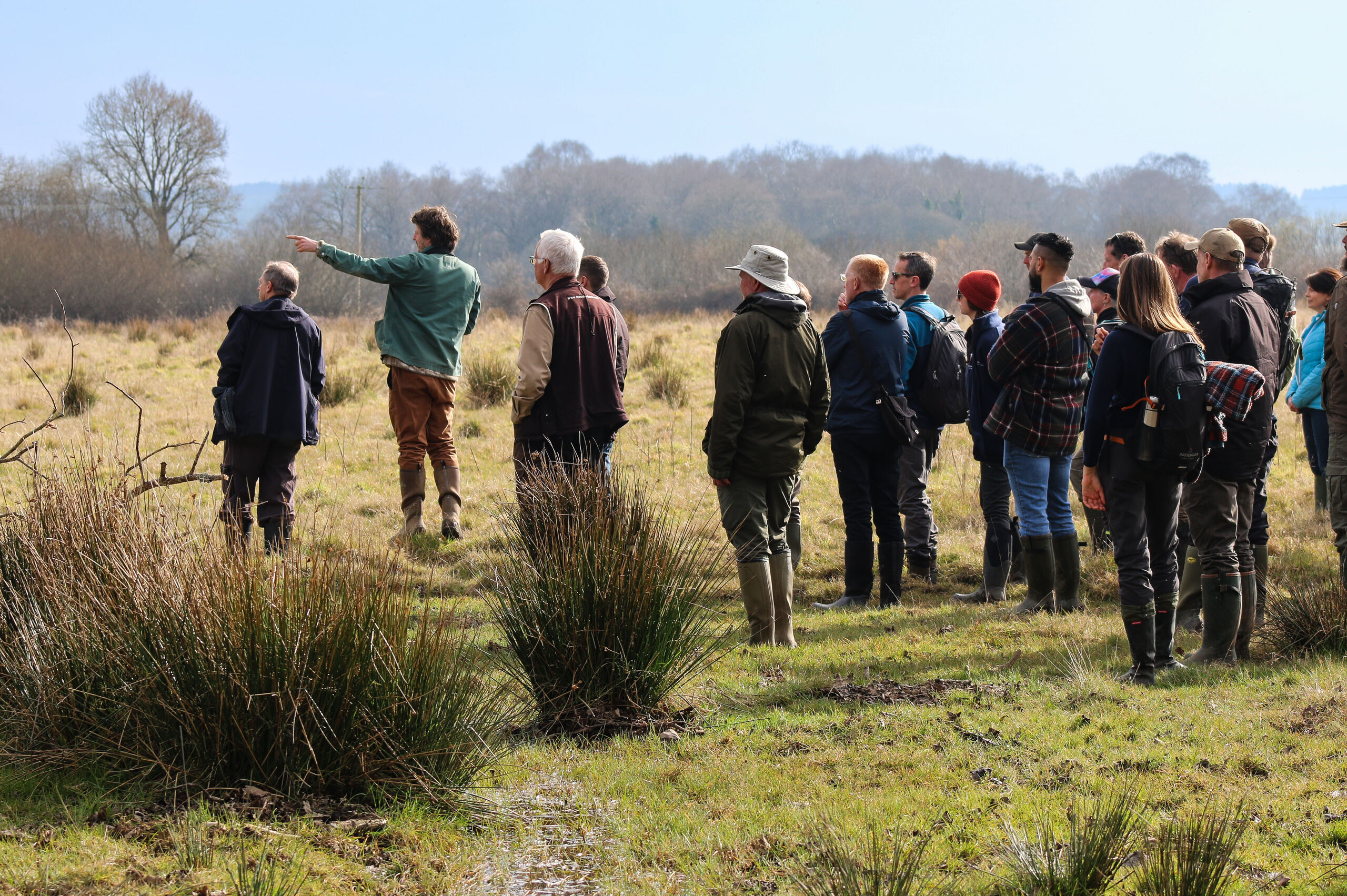 People stood in wet area at wild woodbury landscape