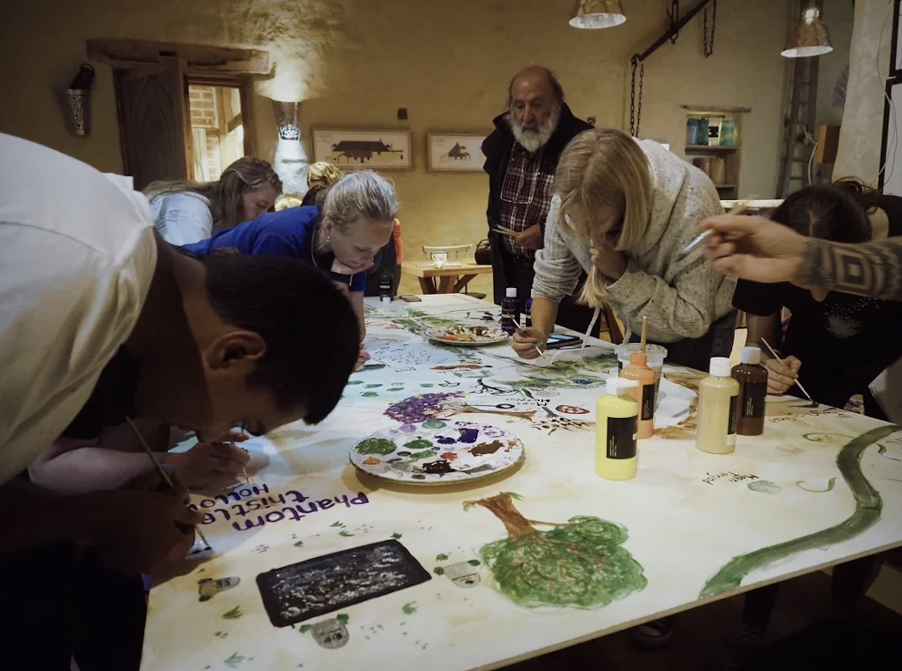 Members of the Penpont Youth Leadership Group create a place name map of the Penpont Project site after walking the land with local artist and knowledge holder Robert MacDonald.