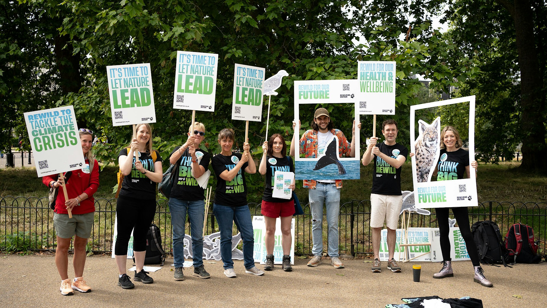 Rewilding Britain team with selfie props at Restore Nature Now march in London, England