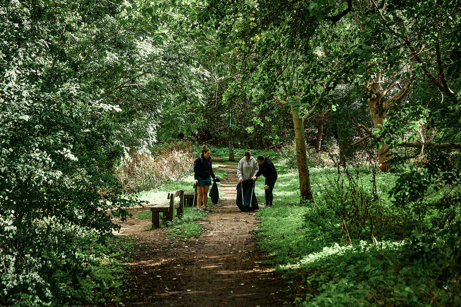 Some staff from TPXimpact cleaning up a rewilding site