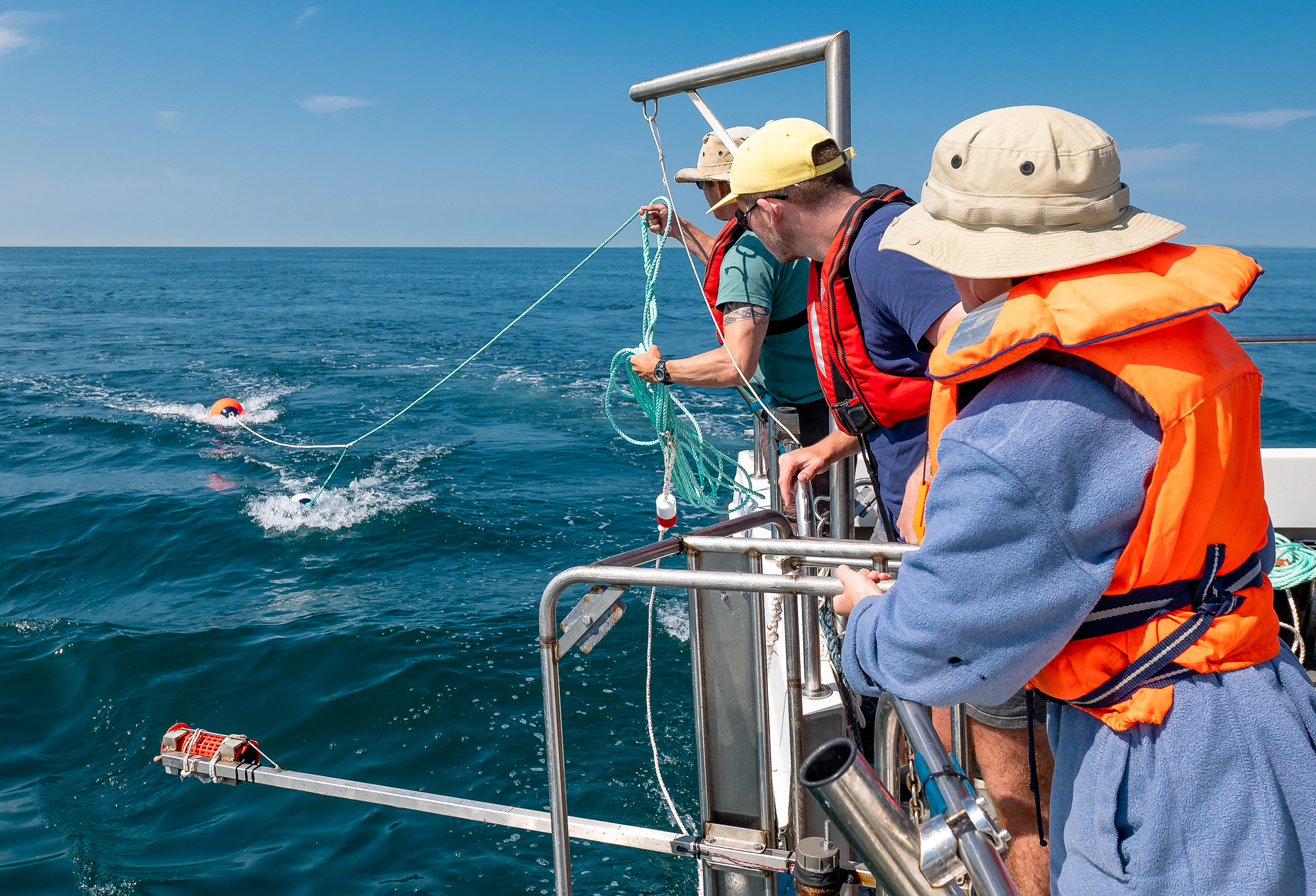 University of Sussex scientists on a boat studying the seabed.